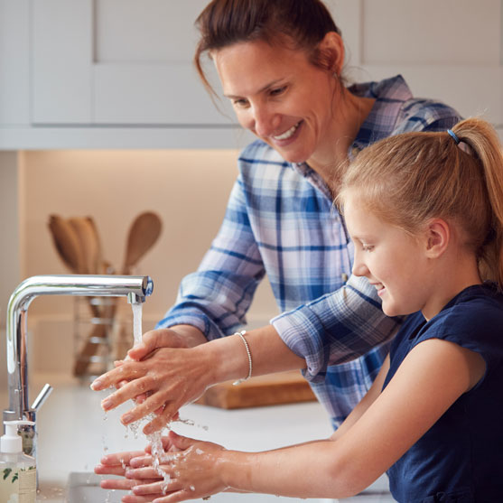 Mother Daughter washing hands